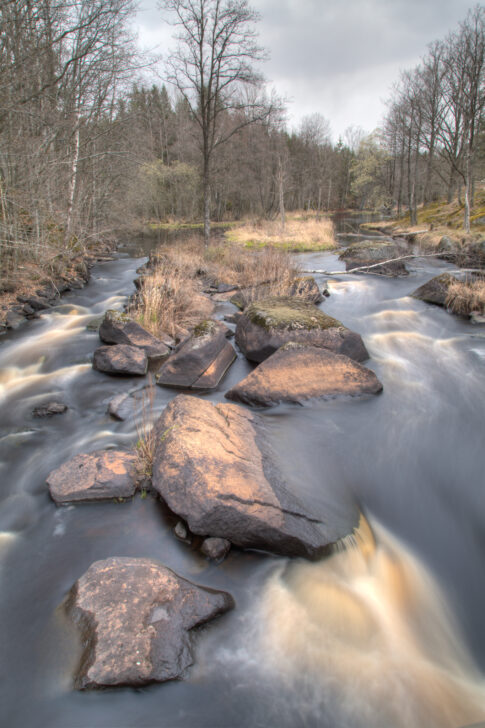 The old mill and bridge at Viekvarn surrounded by Swedish countryside.